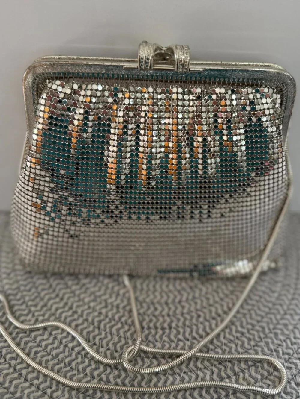 Silver colored mesh pattern purse/clutch